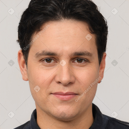 Joyful white adult male with short  brown hair and brown eyes