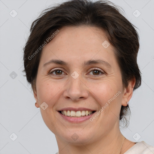 Joyful white adult female with short  brown hair and brown eyes