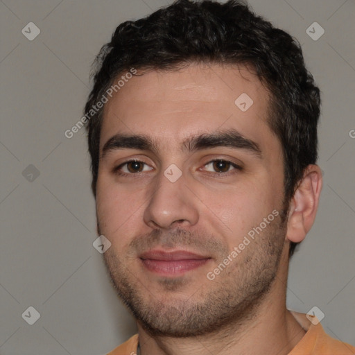 Joyful white young-adult male with short  black hair and brown eyes