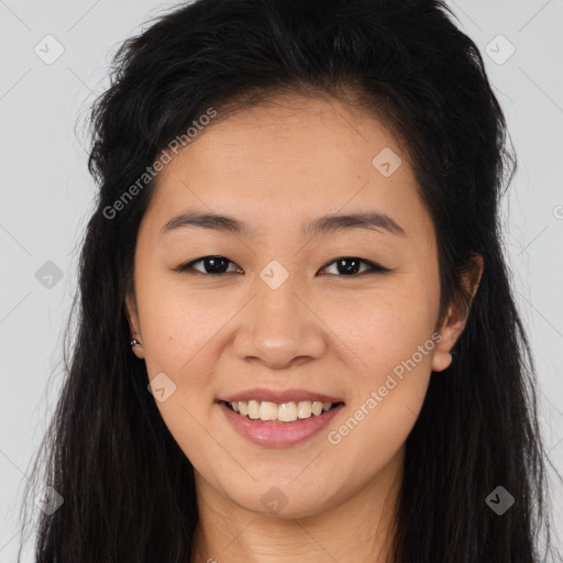 Joyful asian young-adult female with long  brown hair and brown eyes