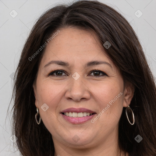 Joyful white adult female with long  brown hair and brown eyes