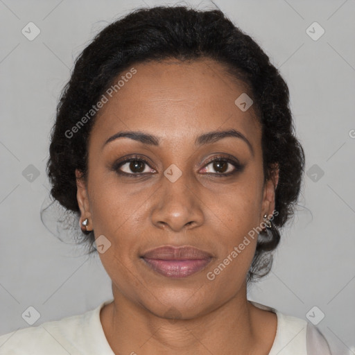 Joyful black adult female with short  brown hair and brown eyes