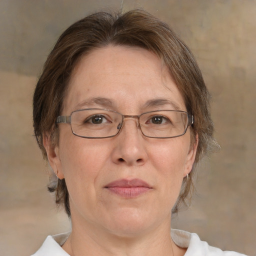 Joyful white middle-aged female with medium  brown hair and brown eyes