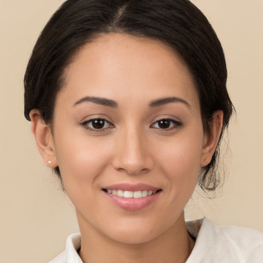 Joyful white young-adult female with medium  brown hair and brown eyes