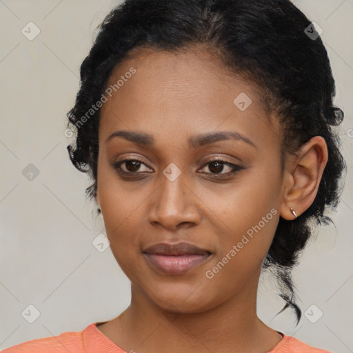 Joyful black young-adult female with medium  black hair and brown eyes