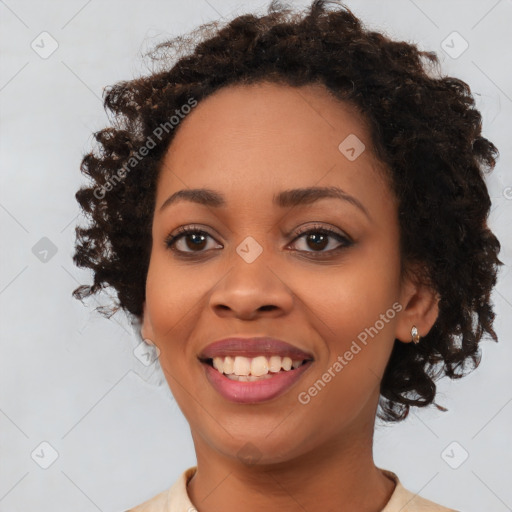 Joyful black young-adult female with medium  brown hair and brown eyes