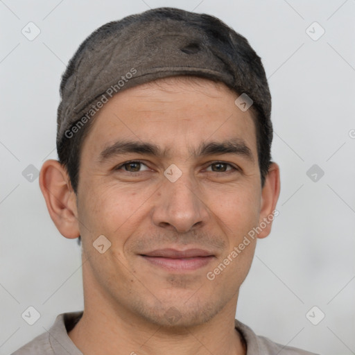 Joyful white adult male with short  brown hair and brown eyes