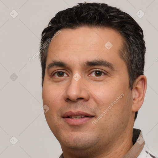 Joyful white young-adult male with short  black hair and brown eyes