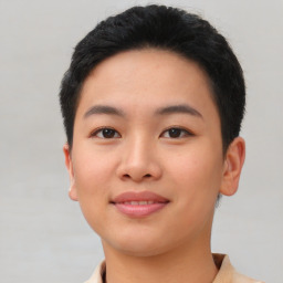 Joyful asian young-adult female with short  black hair and brown eyes