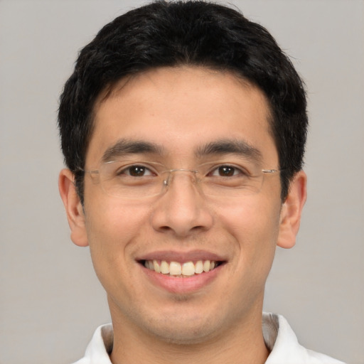 Joyful asian young-adult male with short  brown hair and brown eyes