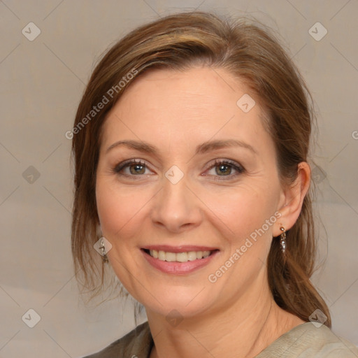 Joyful white adult female with medium  brown hair and grey eyes