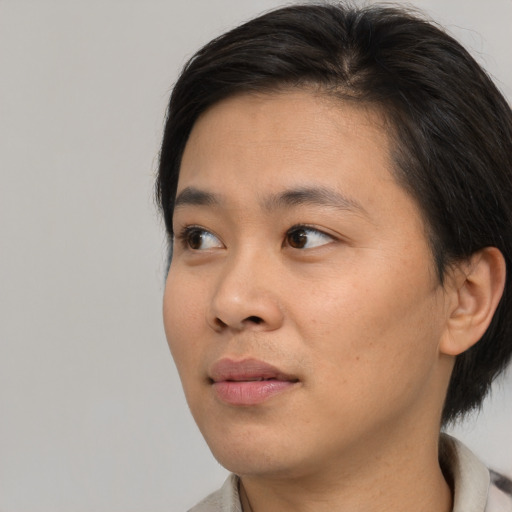 Neutral asian young-adult female with medium  black hair and brown eyes