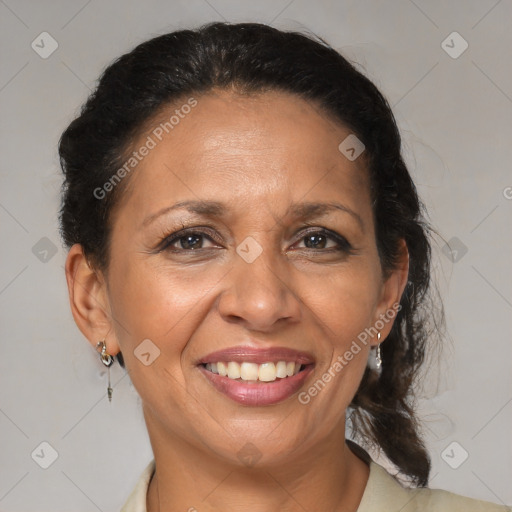 Joyful black adult female with medium  brown hair and brown eyes