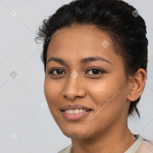 Joyful latino young-adult female with short  brown hair and brown eyes