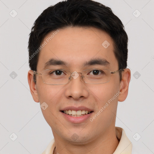 Joyful asian young-adult male with short  brown hair and brown eyes