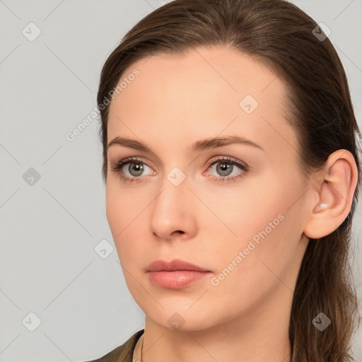 Neutral white young-adult female with long  brown hair and brown eyes