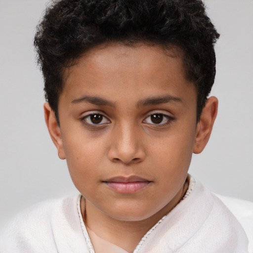 Joyful latino child female with short  brown hair and brown eyes