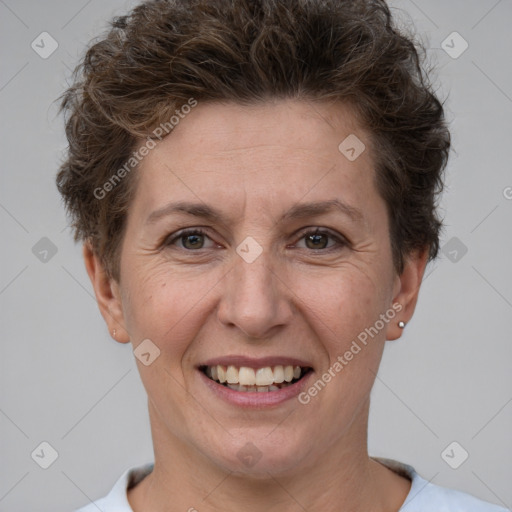 Joyful white adult female with short  brown hair and brown eyes