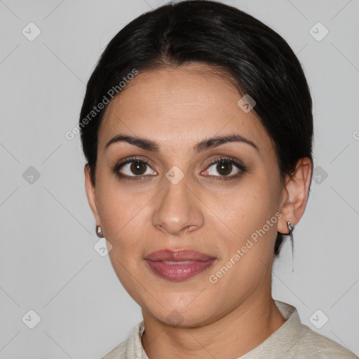 Joyful white young-adult female with medium  black hair and brown eyes