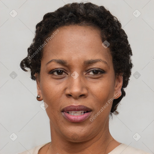 Joyful black adult female with short  brown hair and brown eyes