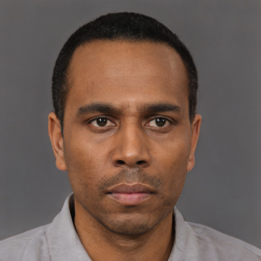 Neutral black young-adult male with short  black hair and brown eyes