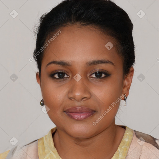 Joyful black young-adult female with short  brown hair and brown eyes