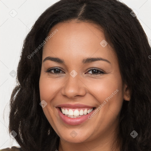 Joyful latino young-adult female with long  brown hair and brown eyes