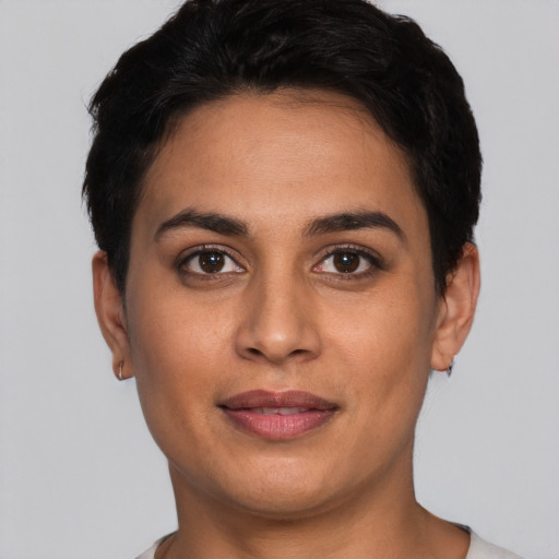 Joyful white young-adult female with short  black hair and brown eyes