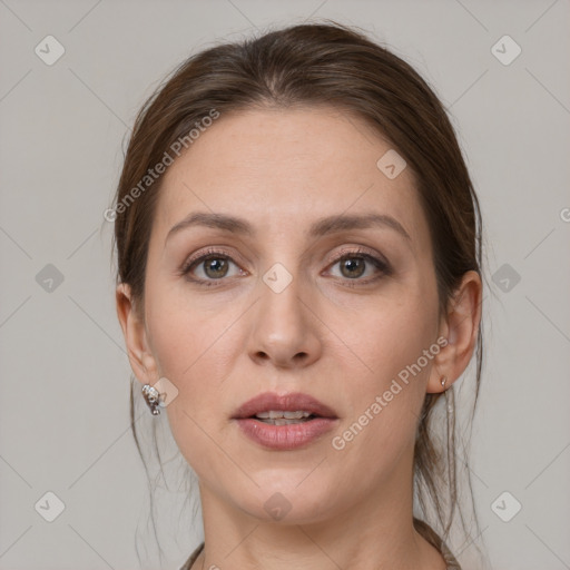 Joyful white adult female with medium  brown hair and grey eyes