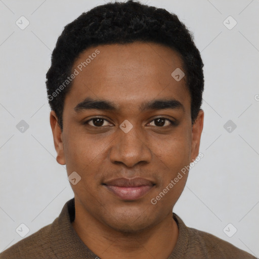 Joyful black young-adult male with short  black hair and brown eyes