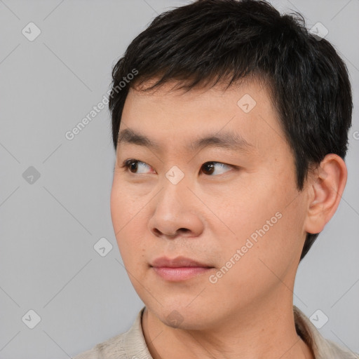 Neutral asian young-adult male with short  black hair and brown eyes