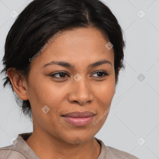 Joyful latino adult female with medium  brown hair and brown eyes