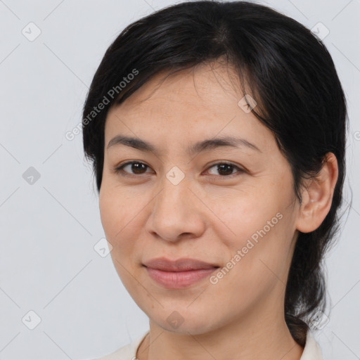 Joyful latino young-adult female with medium  brown hair and brown eyes