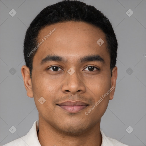 Joyful latino young-adult male with short  black hair and brown eyes