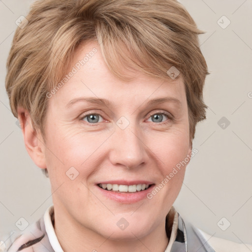 Joyful white adult female with short  brown hair and grey eyes