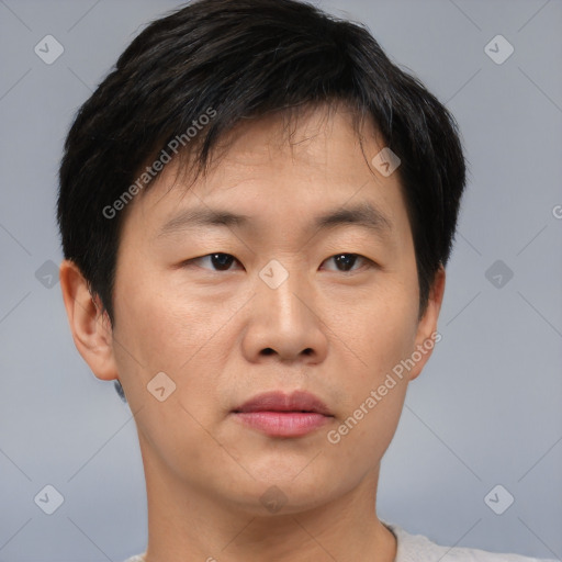 Neutral asian young-adult male with short  brown hair and brown eyes