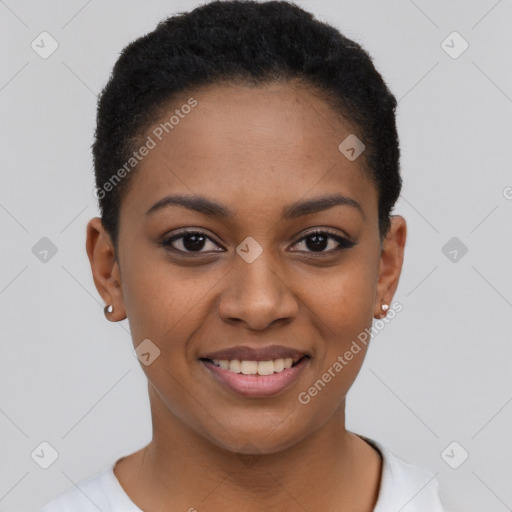 Joyful black young-adult female with short  black hair and brown eyes