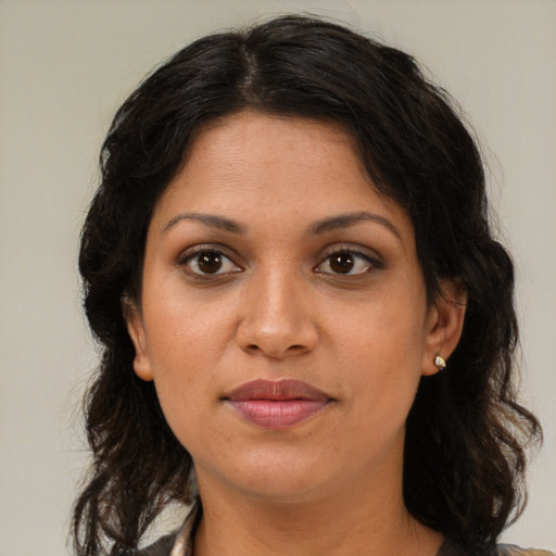 Joyful black young-adult female with medium  brown hair and brown eyes