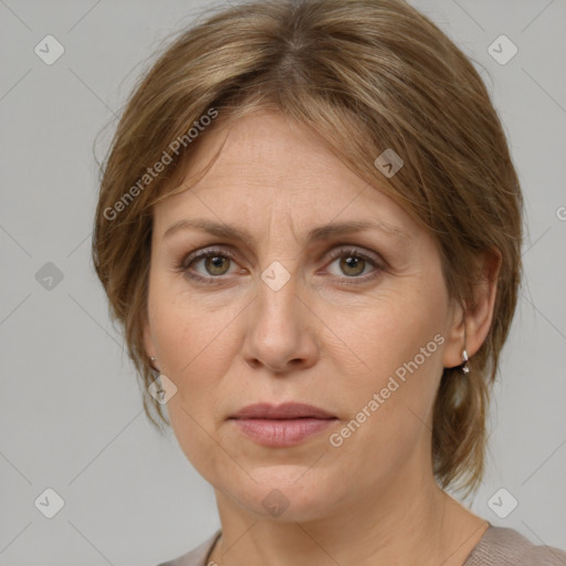 Joyful white adult female with medium  brown hair and grey eyes