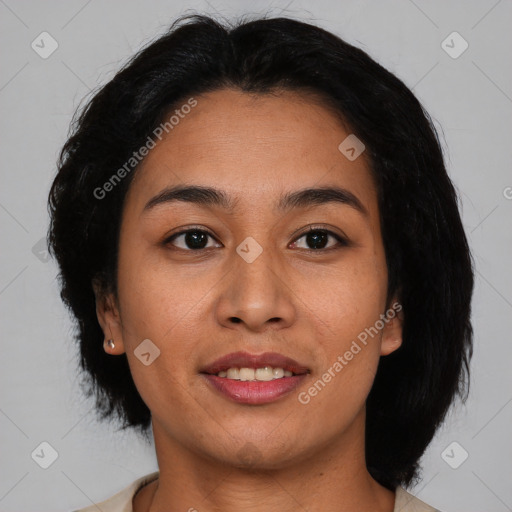 Joyful asian young-adult female with medium  black hair and brown eyes