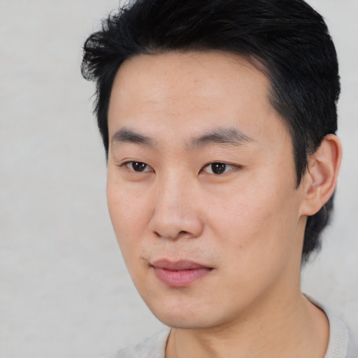 Neutral asian young-adult male with short  black hair and brown eyes