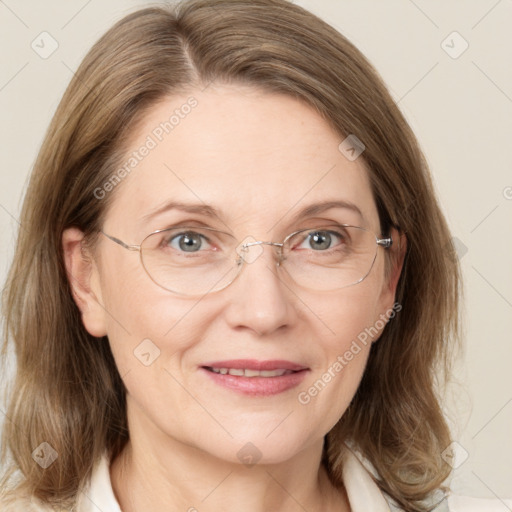 Joyful white adult female with medium  brown hair and grey eyes