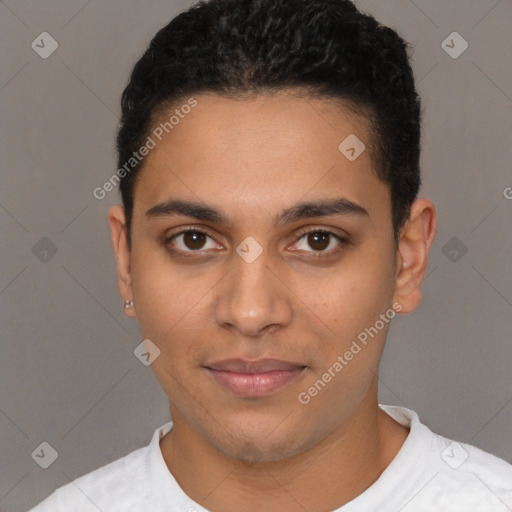 Joyful latino young-adult male with short  black hair and brown eyes