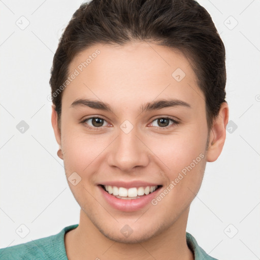 Joyful white young-adult female with short  brown hair and brown eyes