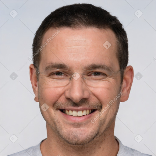 Joyful white adult male with short  brown hair and brown eyes