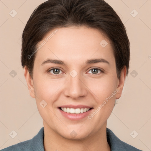 Joyful white young-adult female with short  brown hair and brown eyes