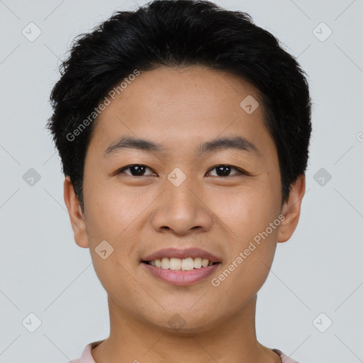 Joyful asian young-adult male with short  black hair and brown eyes