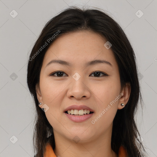 Joyful latino young-adult female with medium  brown hair and brown eyes