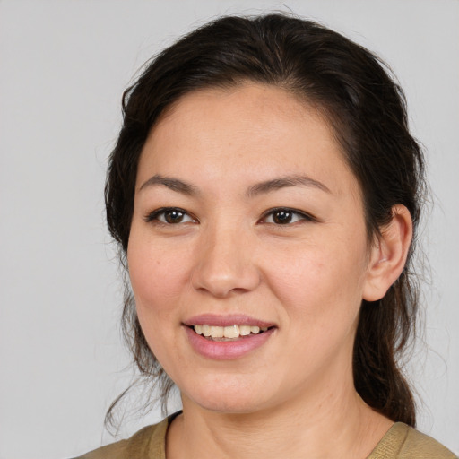 Joyful white young-adult female with medium  brown hair and brown eyes
