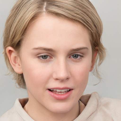 Joyful white young-adult female with medium  brown hair and blue eyes